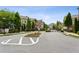 Street view showcases townhouses gated entrance, landscaping, and neatly paved roads in community at 4355 Parkside Pl, Sandy Springs, GA 30342