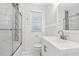Clean bathroom featuring a glass-enclosed shower, modern fixtures, and a sleek vanity at 623 Montevista Sw St, Atlanta, GA 30310