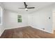 This bedroom features a window, hardwood floors, and a ceiling fan at 623 Montevista Sw St, Atlanta, GA 30310