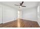 A bright bedroom with one window, hardwood floors and a ceiling fan at 623 Montevista Sw St, Atlanta, GA 30310