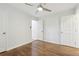 This bedroom features hardwood floors, neutral walls, and a ceiling fan for added comfort at 623 Montevista Sw St, Atlanta, GA 30310