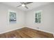 Bright bedroom with two windows offering natural light and beautiful hardwood floors at 623 Montevista Sw St, Atlanta, GA 30310