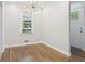 Dining room featuring hardwood floors, a window, and a modern chandelier at 623 Montevista Sw St, Atlanta, GA 30310