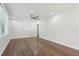Bright living room featuring hardwood floors, large windows, and neutral paint at 623 Montevista Sw St, Atlanta, GA 30310