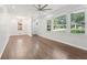 Bright living room featuring hardwood floors, large windows, and a modern light fixture at 623 Montevista Sw St, Atlanta, GA 30310