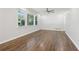 Bright living room featuring hardwood floors, large windows, and neutral paint at 623 Montevista Sw St, Atlanta, GA 30310