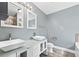 Modern bathroom with dual square sinks, sleek fixtures, and a stylish vanity and a shower at 628 Warren Ave, Scottdale, GA 30079