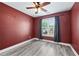 Comfortable bedroom featuring a window with curtains and new hardwood floors at 628 Warren Ave, Scottdale, GA 30079