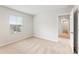 Bright bedroom with carpet and a window overlooking the neighborhood at 7193 Brushwood Bend (Lot 33), Lithonia, GA 30058