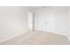 Spare bedroom with closet and entryway, with neutral paint and carpet flooring at 7193 Brushwood Bend (Lot 33), Lithonia, GA 30058