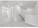 Upstairs hallway featuring neutral carpet, natural light, and doors to bedrooms at 7193 Brushwood Bend (Lot 33), Lithonia, GA 30058