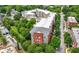An aerial shot shows a multifamily complex nestled among mature trees with street parking available at 870 Mayson Turner Rd Nw # 1111, Atlanta, GA 30314