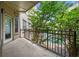 View from balcony of trees surrounding pool at condominium complex with metal railing on patio at 870 Mayson Turner Rd Nw # 1111, Atlanta, GA 30314