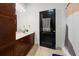 Bathroom featuring a vanity with sink, cabinets, shower, and towel hanger adding comfort and style at 870 Mayson Turner Rd Nw # 1111, Atlanta, GA 30314