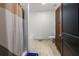 Well-lit bathroom featuring a shower with curtains, a bathtub, vanity and cabinets, providing a functional space at 870 Mayson Turner Rd Nw # 1111, Atlanta, GA 30314