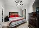 Comfortable bedroom featuring a queen-sized bed with a modern ceiling fan and a large dresser at 870 Mayson Turner Rd Nw # 1111, Atlanta, GA 30314