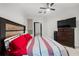 Bright bedroom with a queen bed, ceiling fan, and a view to the outdoor, offering a relaxing space at 870 Mayson Turner Rd Nw # 1111, Atlanta, GA 30314