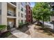 The building's exterior displays a harmonious blend of brick and painted siding, complemented by manicured landscaping at 870 Mayson Turner Rd Nw # 1111, Atlanta, GA 30314