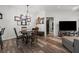Open floor plan showcasing dining area and its proximity to the kitchen, bar seating, and living spaces at 870 Mayson Turner Rd Nw # 1111, Atlanta, GA 30314