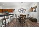 Cozy dining area featuring wood floors and a modern chandelier with seating for four next to the kitchen area at 870 Mayson Turner Rd Nw # 1111, Atlanta, GA 30314