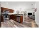 Stylish kitchen and partial view of the living room with stainless steel appliances and wood finish cabinets at 870 Mayson Turner Rd Nw # 1111, Atlanta, GA 30314