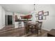Open view of kitchen area flowing to dining table with seats for four plus bar seating, offering easy kitchen access at 870 Mayson Turner Rd Nw # 1111, Atlanta, GA 30314