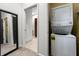 Convenient laundry area featuring a stacked washer and dryer inside the apartment at 870 Mayson Turner Rd Nw # 1111, Atlanta, GA 30314