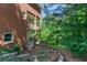 The backyard features a winding stone path that leads to the home's back porch at 140 Longwater Cv, Roswell, GA 30075