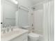 White bathroom with single sink vanity, framed mirror, shower-tub and toilet at 140 Longwater Cv, Roswell, GA 30075