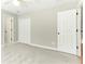 Neutral bedroom with multiple closets and doors, and plush grey carpeting at 140 Longwater Cv, Roswell, GA 30075