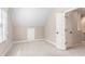 Bedroom with plush carpet, closet, and en suite bathroom at 140 Longwater Cv, Roswell, GA 30075