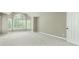Spacious bedroom features neutral walls, plush carpeting, and abundant natural light through several windows at 140 Longwater Cv, Roswell, GA 30075