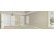 This bedroom features an en suite bathroom, closet, a large window, and plush carpeting at 140 Longwater Cv, Roswell, GA 30075