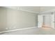 This bedroom features plush carpeting, a walk-in closet, and neutral paint scheme at 140 Longwater Cv, Roswell, GA 30075