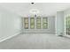 This bonus room features plenty of natural light and a door that leads to a balcony at 140 Longwater Cv, Roswell, GA 30075