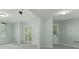 This spacious bonus room features a large living area and access to an outdoor balcony at 140 Longwater Cv, Roswell, GA 30075