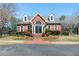 Attractive brick building featuring a symmetrical design, well-maintained landscaping, and inviting entrance at 140 Longwater Cv, Roswell, GA 30075