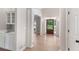 Elegant foyer with hardwood floors, a column, a front door and a dry bar at 140 Longwater Cv, Roswell, GA 30075
