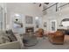 Bright living room with built-in shelving, fireplace, and open floor plan at 140 Longwater Cv, Roswell, GA 30075