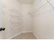 A well-organized walk-in closet with multiple shelves for optimal storage and organization at 140 Longwater Cv, Roswell, GA 30075