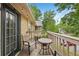 This charming outdoor balcony with seating and potted plants surrounded by trees at 2304 Country Park Se Dr, Smyrna, GA 30080