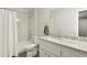 A bathroom featuring granite countertops, a tub, and a stylish shower at 2304 Country Park Se Dr, Smyrna, GA 30080