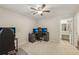 A cozy bedroom featuring a ceiling fan, and a bathroom door to the side at 2304 Country Park Se Dr, Smyrna, GA 30080