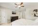 This bedroom features a ceiling fan, a large dresser, and stylish artwork at 2304 Country Park Se Dr, Smyrna, GA 30080