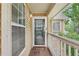 Charming porch with wood floors and views, creating a welcoming entrance to this home at 2304 Country Park Se Dr, Smyrna, GA 30080