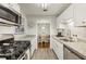 Modern kitchen with stainless steel appliances and granite countertops at 2304 Country Park Se Dr, Smyrna, GA 30080