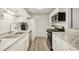 Well-lit kitchen featuring granite countertops and stainless steel appliances at 2304 Country Park Se Dr, Smyrna, GA 30080