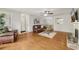 Open living room with hardwood floors flows into the dining area and kitchen at 2304 Country Park Se Dr, Smyrna, GA 30080