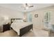 Serene bedroom with a door to the outside, soft carpet, and ample natural light at 2304 Country Park Se Dr, Smyrna, GA 30080