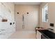 Modern bathroom featuring a soaking tub, dual shower heads, and marble accents for a luxurious spa experience at 245 Roycroft Ln, Fayetteville, GA 30214